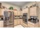 Modern kitchen features stainless steel appliances, ample cabinetry, and granite countertops at 9201 Yucca Blossom Dr, Las Vegas, NV 89134