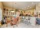 Spacious eat-in kitchen features breakfast bar, and dining area with tile floors and ample cabinetry at 9201 Yucca Blossom Dr, Las Vegas, NV 89134