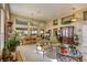 Spacious living room with high ceilings, large windows, and views into the dining room at 9201 Yucca Blossom Dr, Las Vegas, NV 89134