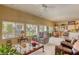 Bright living room with plush seating, open to dining area and featuring large windows with garden views at 9201 Yucca Blossom Dr, Las Vegas, NV 89134