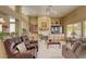 Comfortable living room with built-in shelving, a fireplace, and plush seating at 9201 Yucca Blossom Dr, Las Vegas, NV 89134