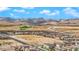 Scenic aerial shot of a housing development near desert landscapes and mountain ranges at 9947 Tucket Point Ct, Las Vegas, NV 89178