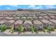 An elevated view of a new construction neighborhood, showing many two story homes, and desert mountains in the distance at 9947 Tucket Point Ct, Las Vegas, NV 89178