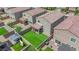 Aerial view showcasing a well-maintained backyard with artificial turf and a covered patio at 9947 Tucket Point Ct, Las Vegas, NV 89178