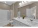Bathroom featuring double sink, walk-in shower, and modern fixtures at 9947 Tucket Point Ct, Las Vegas, NV 89178