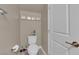 Cozy half-bathroom with toilet and framed artwork above at 9947 Tucket Point Ct, Las Vegas, NV 89178