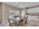 Dining area featuring backyard views, wood-look floors and stylish pendant lighting at 9947 Tucket Point Ct, Las Vegas, NV 89178