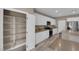 Modern kitchen with stainless steel appliances, white cabinets, and pantry at 9947 Tucket Point Ct, Las Vegas, NV 89178