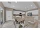 Modern kitchen and dining area with white cabinets and stainless steel appliances at 9947 Tucket Point Ct, Las Vegas, NV 89178