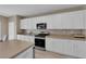 Modern kitchen with stainless steel appliances and pantry at 9947 Tucket Point Ct, Las Vegas, NV 89178