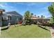 Enjoy the spacious backyard offering artificial turf, mature trees, a swing set, and a hammock at 2093 Seahurst Dr, Las Vegas, NV 89142