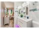 A bright bathroom that has a sink and toilet at 2093 Seahurst Dr, Las Vegas, NV 89142
