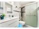 Modern bathroom with sleek vanity, glass shower door, and ambient lighting at 2093 Seahurst Dr, Las Vegas, NV 89142