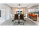 This dining area offers natural lighting, an aquarium, and flows into the kitchen with barstool seating at 2093 Seahurst Dr, Las Vegas, NV 89142