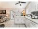 Bright kitchen featuring white cabinets, light countertops, stainless steel appliances, and an open layout at 2093 Seahurst Dr, Las Vegas, NV 89142