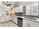 A beautifully renovated kitchen showcasing sleek white cabinets and a decorative backsplash at 2093 Seahurst Dr, Las Vegas, NV 89142