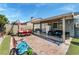 Entertain on this covered patio and enjoy backyard living with dining and lounge furniture at 2093 Seahurst Dr, Las Vegas, NV 89142