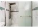 Modern shower with multiple showerheads and decorative tile at 2093 Seahurst Dr, Las Vegas, NV 89142