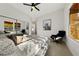 Bright main bedroom featuring a ceiling fan, closet with sliding doors, and a modern accent chair at 2548 Faiss Dr, Las Vegas, NV 89134