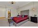 Luxurious main bedroom suite with a chandelier, sitting bench, and access to the ensuite bathroom at 2548 Faiss Dr, Las Vegas, NV 89134