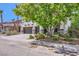 Spacious home with a three-car garage, mature trees, and a well-kept lawn at 2608 Prospector Mine Ave, North Las Vegas, NV 89031