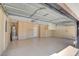 Spacious garage with built-in storage cabinets, epoxy flooring, and ample room for vehicles at 2608 Prospector Mine Ave, North Las Vegas, NV 89031
