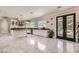 Bright and airy kitchen featuring an island, stainless steel appliances, and access to the backyard pool at 2608 Prospector Mine Ave, North Las Vegas, NV 89031