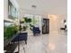 Bright living room showcasing modern marble floors, stylish furnishings, and large windows for ample natural light at 2608 Prospector Mine Ave, North Las Vegas, NV 89031