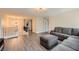 Spacious living room with a modern staircase, plush furniture, and a stylish chandelier at 2608 Prospector Mine Ave, North Las Vegas, NV 89031