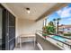Balcony overlooking a community pool with views of palm trees and desert landscaping at 2627 S Durango Dr # 201, Las Vegas, NV 89117