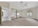 Spacious bedroom with a ceiling fan, carpet, and a large closet with mirrored doors at 2627 S Durango Dr # 201, Las Vegas, NV 89117