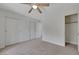 A bedroom features carpet, white walls, a closet, and an entry to a smaller closet at 2627 S Durango Dr # 201, Las Vegas, NV 89117