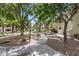 Landscaped community courtyard with mature trees and walkways in residential area at 2627 S Durango Dr # 201, Las Vegas, NV 89117