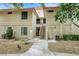 Exterior of a residential building with desert landscaping and walkways at 2627 S Durango Dr # 201, Las Vegas, NV 89117