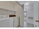 A laundry room with a side by side washer and dryer and added shelving at 2627 S Durango Dr # 201, Las Vegas, NV 89117