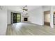 Spacious living room with a fireplace, sliding glass doors to balcony, and hardwood floors at 2627 S Durango Dr # 201, Las Vegas, NV 89117