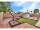 A landscaped backyard with artificial turf and a shed at 4630 Pratt Way, Las Vegas, NV 89147