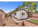 Quaint backyard featuring a mix of hardscape, gravel, and artificial turf, offering a unique outdoor living space at 4630 Pratt Way, Las Vegas, NV 89147