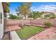 Private backyard featuring unique grass squares and brick pavers, perfect for relaxation and entertaining at 4630 Pratt Way, Las Vegas, NV 89147