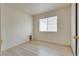 Clean and bright bedroom with neutral walls, new flooring, and a window with natural light at 4630 Pratt Way, Las Vegas, NV 89147
