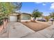 Charming home features a well-maintained lawn and a private driveway leading to an attached garage at 4630 Pratt Way, Las Vegas, NV 89147