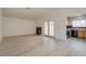 Bright and airy living room features new flooring, high ceilings, fireplace, and view into kitchen at 4630 Pratt Way, Las Vegas, NV 89147