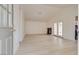 Bright and airy living room features new flooring, high ceilings, fireplace, and patio access at 4630 Pratt Way, Las Vegas, NV 89147
