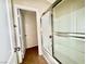 Bathroom with a shower and tub combination behind a glass door, and a separate toilet room at 5517 Overlook Valley St, North Las Vegas, NV 89081