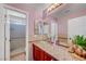 Bathroom features an updated vanity, shower, tile surround, and glass bowl sink at 5716 Breckenridge St, North Las Vegas, NV 89081