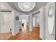 Open foyer with stylish light fixture, flowing into a spacious living area with ample natural light at 5716 Breckenridge St, North Las Vegas, NV 89081