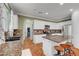 Bright kitchen with white cabinets, granite countertops, stainless steel appliances, and tile backsplash at 5716 Breckenridge St, North Las Vegas, NV 89081