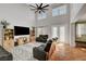 Spacious living room features a large TV, built-in shelves, and comfortable seating for the whole Gathering at 5716 Breckenridge St, North Las Vegas, NV 89081