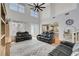 Bright living room featuring high ceilings, lots of natural light, and comfortable, modern seating at 5716 Breckenridge St, North Las Vegas, NV 89081