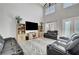 Inviting living room features a large screen TV, plenty of seating, and stylish décor at 5716 Breckenridge St, North Las Vegas, NV 89081